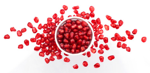 Pomegranate seeds isolated on white background, top view