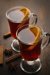 Two glass cups with hot mulled wine