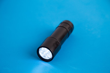 LED flashlight, in colorful background