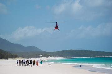 Helicopter landing on Whitehaven Beach, Whitsunday islands, Queensland, Australia