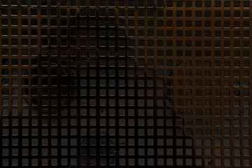 Closeup of small squared grid black Metallic texture background