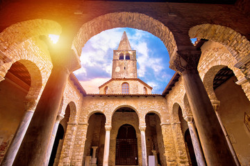 Euphrasian Basilica in Porec arcades and tower sun haze view