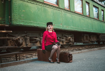 Retro woman on the train station