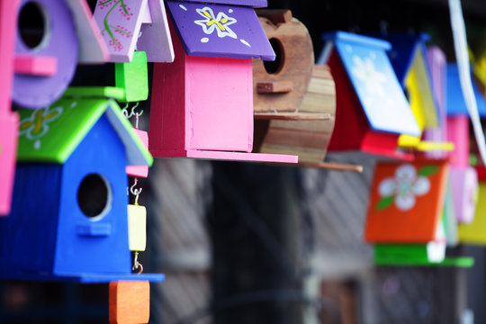 colorful wooden bird house background.