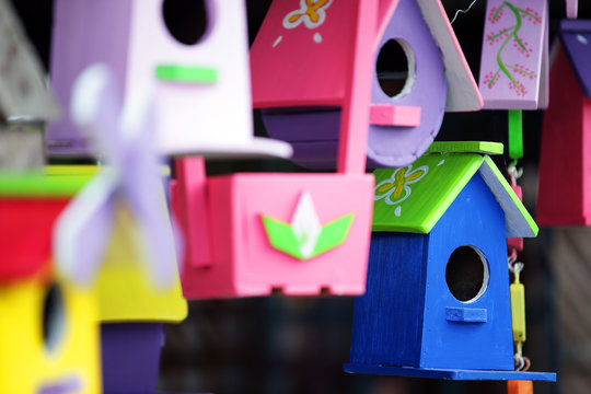colorful wooden bird house background.