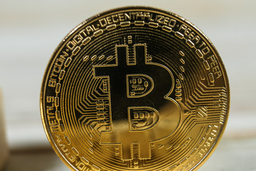 Golden bitcoin isolated on white background