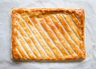 Whole puff pastry pie with golden brown crunch.