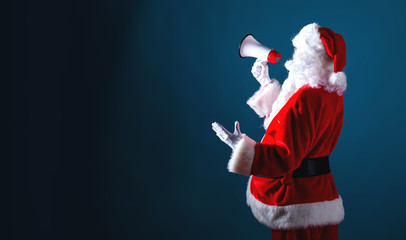 Santa holding a megaphone on a dark blue background