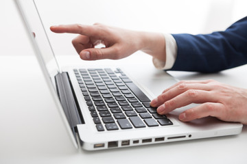 Fototapeta na wymiar Close Up of businessman hands using laptop computer
