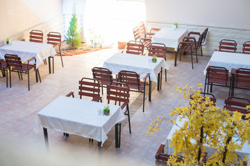 Restaurant empty table and chairs, Cafe terrace table