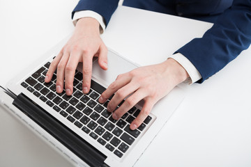 Fototapeta na wymiar Close Up of businessman hands using laptop computer