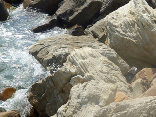 Water splashes between rocks.