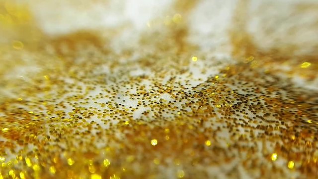 Golden Wet Glitter On a Paper With Uneven Edge. Macro Close Up Shot.
