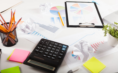 Photo diagrams graphs and numerals in the table on the paper