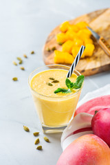 Mango lassi, indian drink, smoothie beverage with yogurt