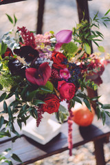 set of autumn wedding decor outdoors. Floral arrangement of flowers and fruits. details of the wedding ceremony. staging for the newlyweds decorator