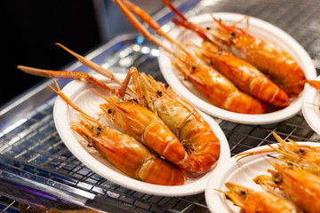 Grilled shrimps seafood on the table in market of Bangkok Thailand 