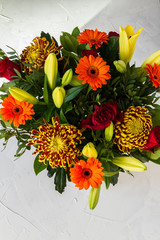 Obraz na płótnie Canvas Orange, yellow and red flowers bouquet. White backround.