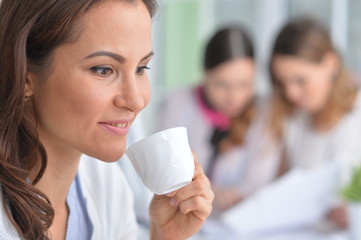 Portrait of a young woman during coffee break