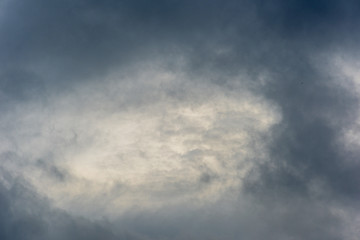 Dramatic cloudy sky with a bright light