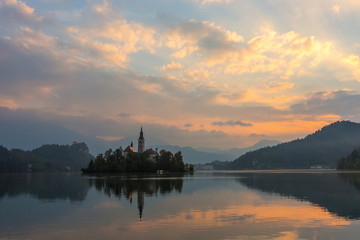 Fototapeta na wymiar Church on island in Lake Bled on sunrise, Slovenia