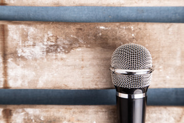microphone on wooden background