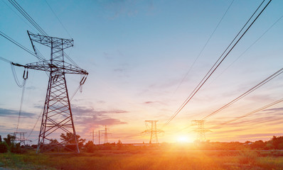 Fototapeta premium High-voltage power lines. Electricity distribution station. high voltage electric transmission tower. Distribution electric substation with power lines and transformers