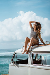 Beautiful woman relaxing enjoy road trip nature sitting on the r