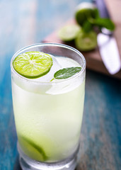 Fresh cooled lemonade over a blue table