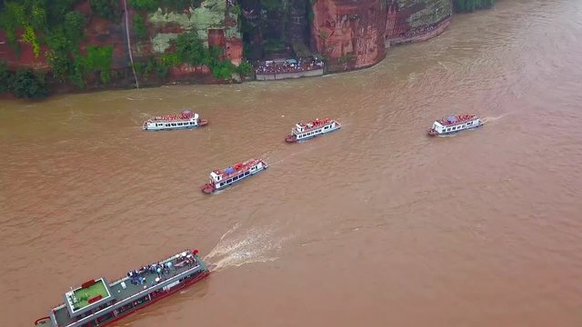 Rain in front of the biggest buddha in the world, carve in the mountains of Leshan, Lingyun Shan Mountain, Sichuan, China