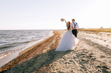 bride and groom on the seashore. wedding concept on the sea, on a fabulous island. - 231896801