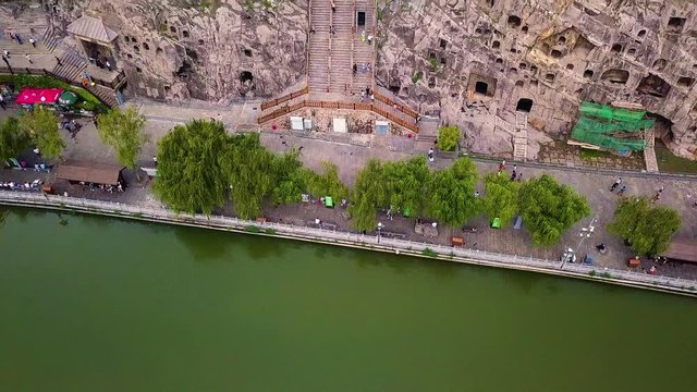 Aerial view over The Longmen Grottoes or Longmen Caves. Housing tens of thousands of statues of Buddha at Luoyang in Henan province, China.