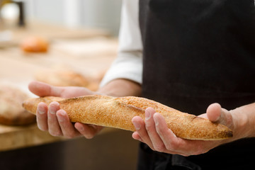 Man is showing baguette