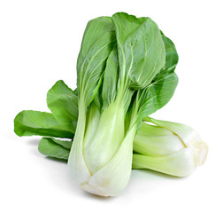 Fresh pak choi cabbage or chinese cabbage, isolated on white background. Fresh, green vegetable, close-up shot. Healthy lifestyle theme, kitchen scene. - obrazy, fototapety, plakaty