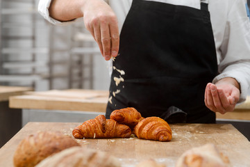 Croissants topped with almond flakes