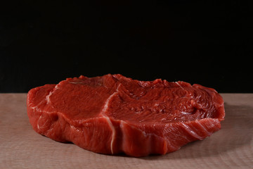 raw meat on black  background