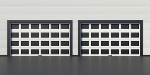 Two industrial garage doors with windows on industrial warehouse building wall