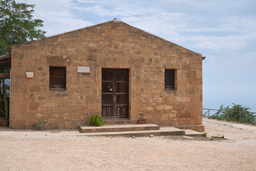 Fototapeta na wymiar Selinunte, Italy - September 02, 2018: Guardian house at selinunte archaeological park