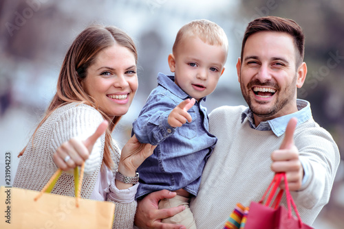 "Happy family with shopping bags" Stockfotos und