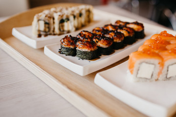 Philadelphia roll sushi cucumber, avocado, cream cheese, red caviar. Sushi menu