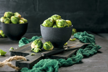 Fresh raw brussels sprouts on a wooden table