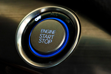 Engine start button in modern car close
