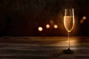 Abwaschbare Fototapete Alkohol Festive background with a champagne glass