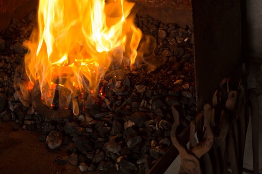Horseshoe being heated in fire