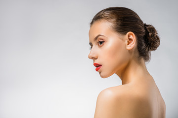 profile of young beautiful woman with red lips