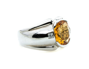 classic ring with a yellow/orange topaz stone on white background