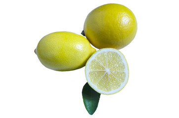 two lemons half lemon and green leaf on white isolate background