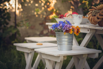 table with flowers in the garden