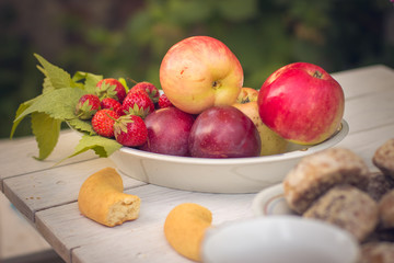 apples in a basket on wooden table