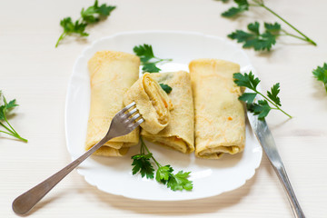 thin fried pancakes stuffed with stewed cabbage